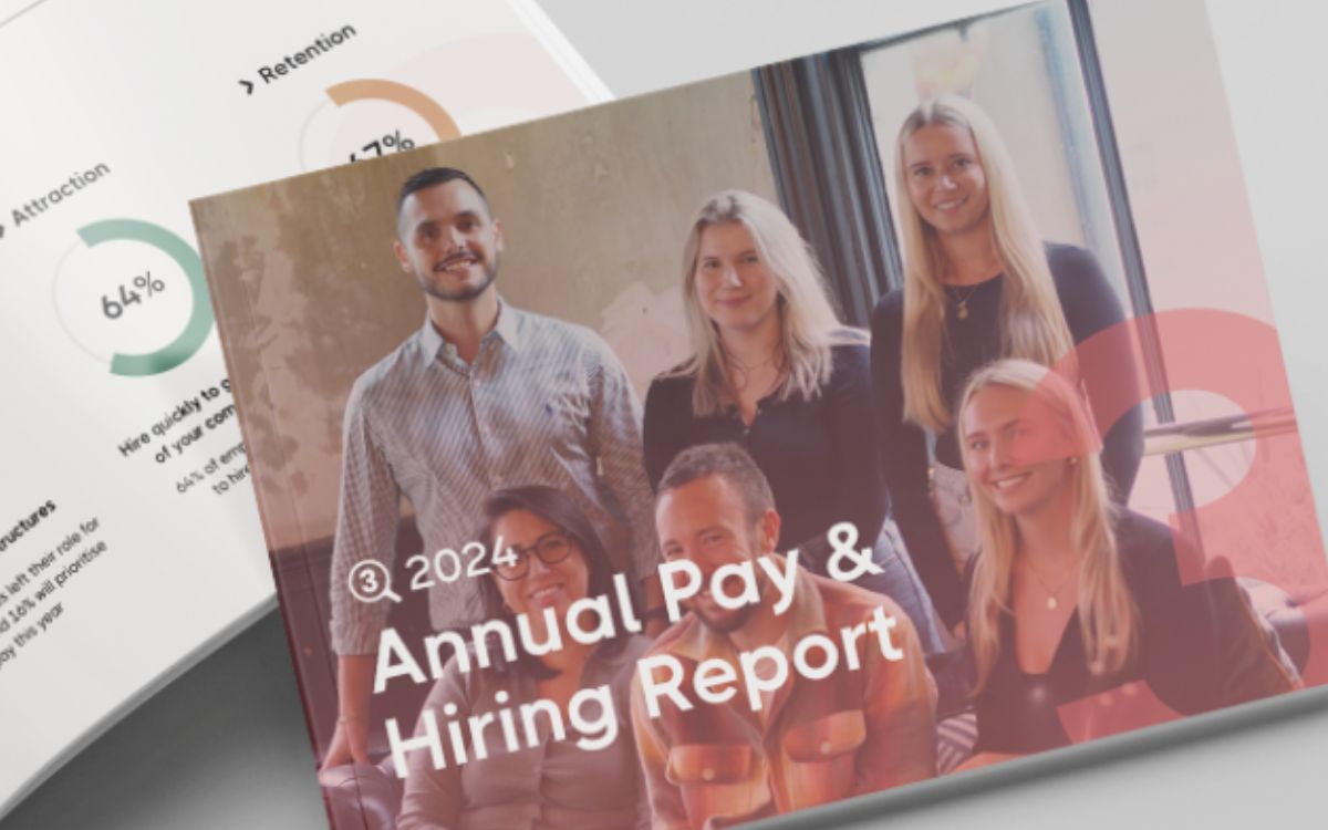 Close up image of a printed copy of 3Search's 2024 Annual Pay & Hiring Report, sitting on top of a second open copy.